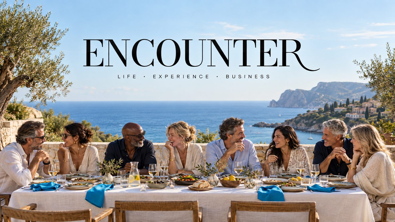 Encounter members sharing a long dinner by the sea